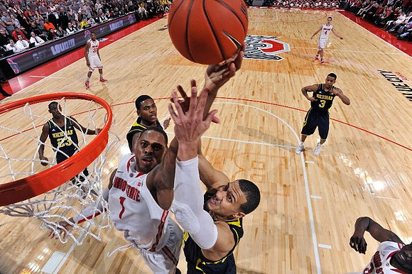 Caris LeVert (23), Glenn Robinson III (1), Jordan Morgan (52), and Trey Burke (3)