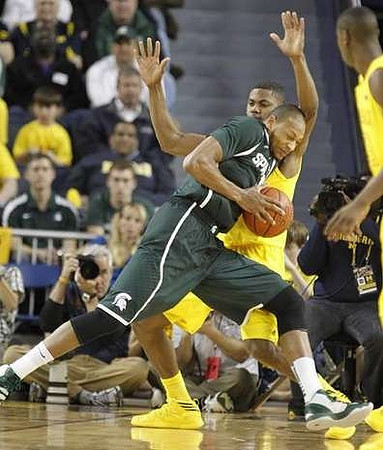 Glenn Robinson III (1) and Caris LeVert (23)