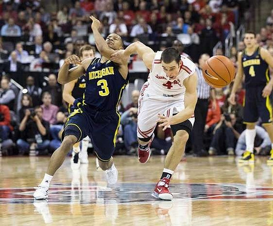 Trey Burke (3), Spike Albrecht (2), and Mitch McGary (4)