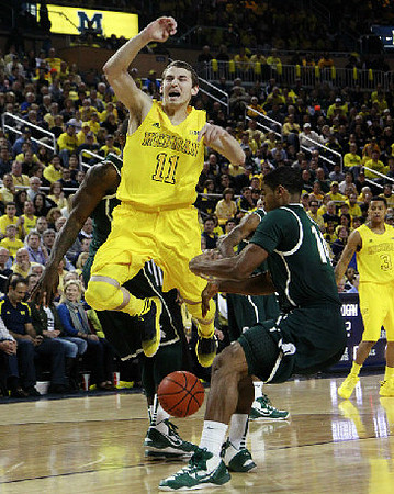 Nik Stauskas (11) and Trey Burke (3)