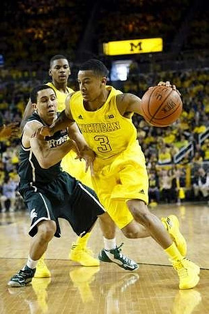 Trey Burke (3) and Glenn Robinson III (1)