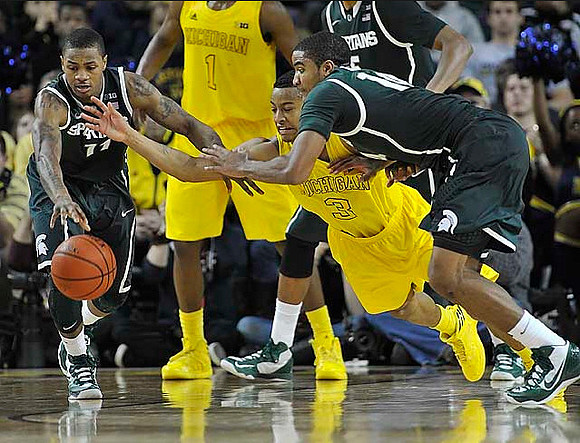Glenn Robinson III (1) and Trey Burke (3)