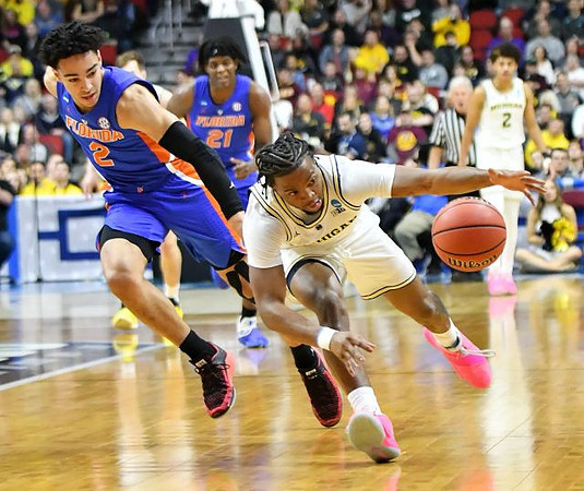 Zavier Simpson (3) and Jordan Poole (2)