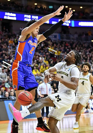 Zavier Simpson (3) and Isaiah Livers (4)