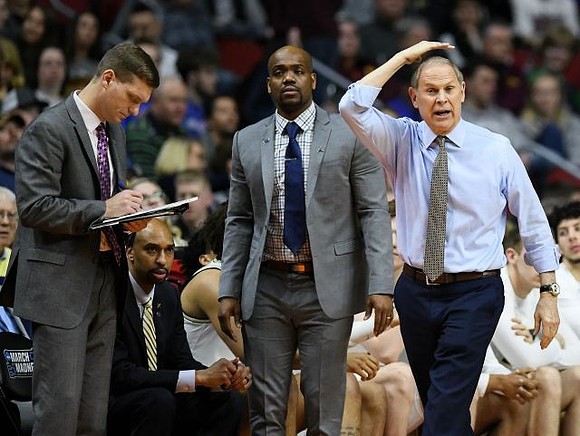 Luke Yaklich, Saddi Washington, Deandre Haynes, and John Beilein