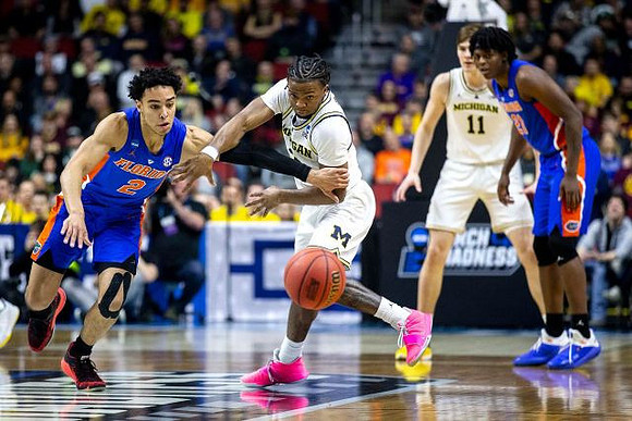 Zavier Simpson (3) and Colin Castleton (11)
