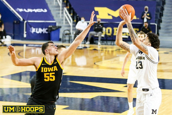 Brandon Johns Jr. (23) and Austin Davis (51)