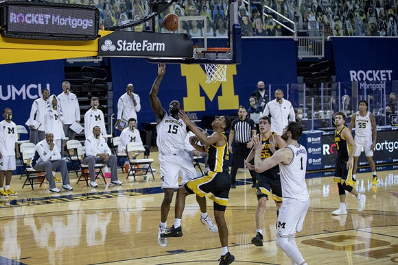 Chaundee Brown Jr. (15), Hunter Dickinson (1), and Eli Brooks (55)