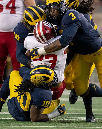 Devin Bush (10), Chase Winovich (15), Rashan Gary (3), and Devin Gil (36)