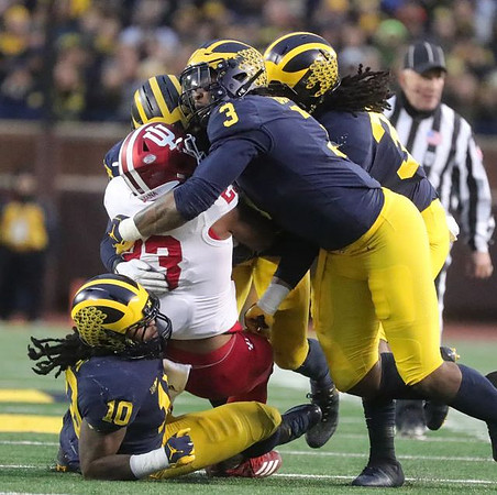 Devin Bush (10), Rashan Gary (3), and Devin Gil (36)