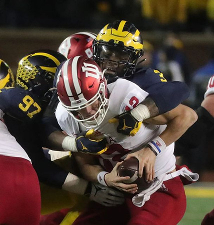 Aidan Hutchinson (97) and Rashan Gary (3)