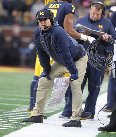Jim Harbaugh, Tarik Black (7), and Ed Warinner