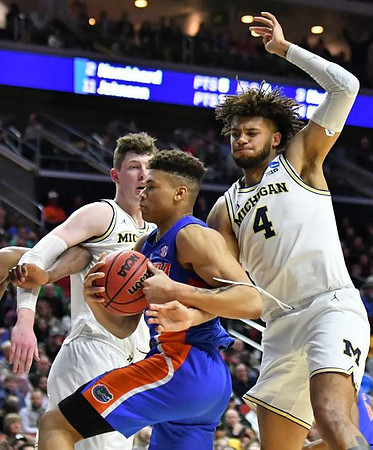 Jon Teske (15) and Isaiah Livers (4)