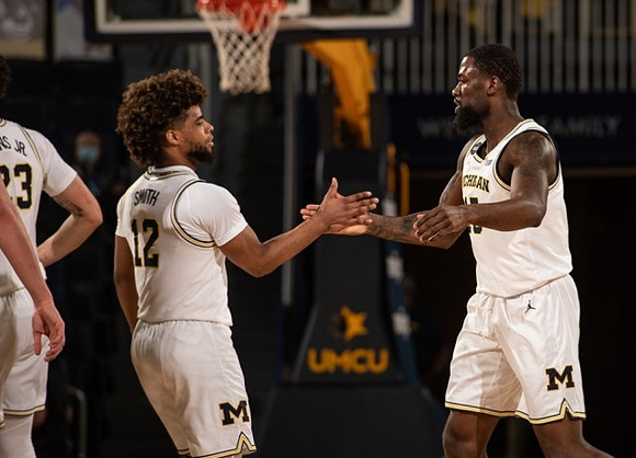 Brandon Johns Jr. (23), Mike Smith (12), and Chaundee Brown Jr. (15)