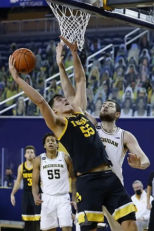 Eli Brooks (55) and Hunter Dickinson (1)