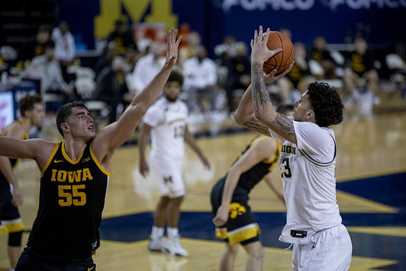 Brandon Johns Jr. (23) and Mike Smith (12)