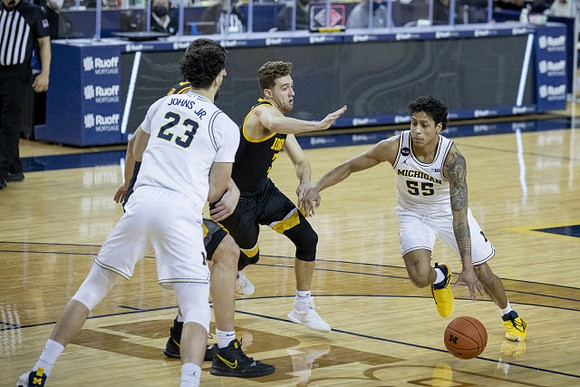 Brandon Johns Jr. (23) and Eli Brooks (55)