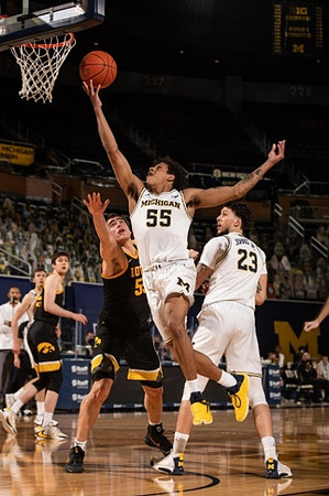 Eli Brooks (55) and Brandon Johns Jr. (23)