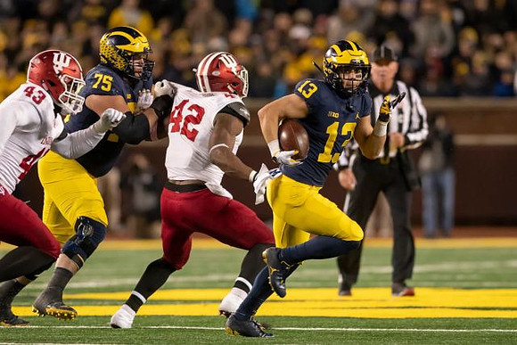 Jon Runyan Jr. (75) and Tru Wilson (13)
