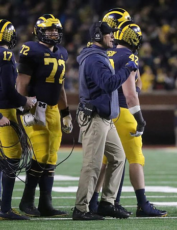 Will Hart (17), Stephen Spanellis (72), Jim Harbaugh, and Ben Mason (42)