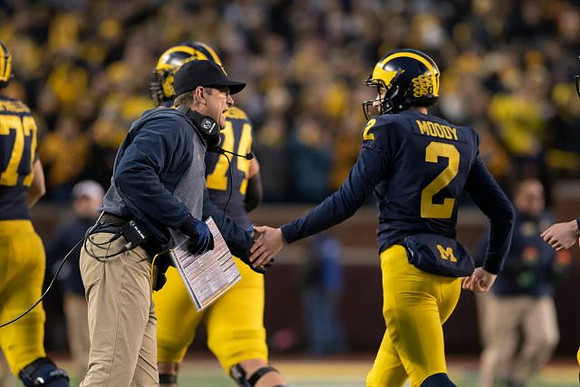 Stephen Spanellis (72), Ben Bredeson (74), Jim Harbaugh, and Jake Moody (2)