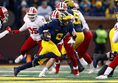 Shea Patterson (2) and Michael Onwenu (50)