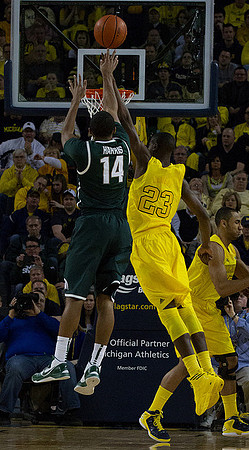 Caris LeVert (23) and Jon Horford (15)