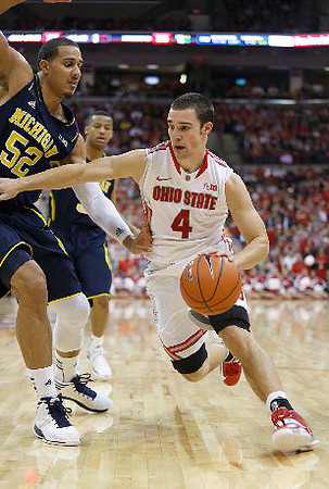 Jordan Morgan (52) and Trey Burke (3)