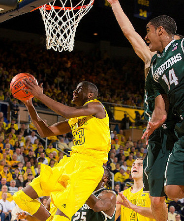Caris LeVert (23) and Mitch McGary (4)