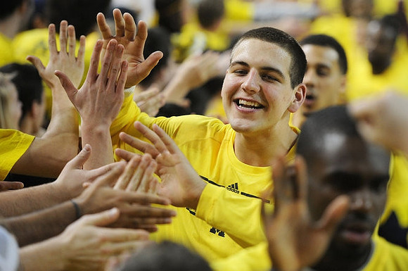 Mitch McGary (4), Tim Hardaway Jr. (10), and Jordan Morgan (52)