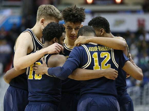 Moritz Wagner (13), Derrick Walton Jr. (10), D.J. Wilson (5), Muhammad-Ali Abdur-Rahkman (12), and Zak Irvin (21)