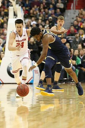 Derrick Walton Jr. (10) and Moritz Wagner (13)