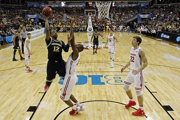 Muhammad-Ali Abdur-Rahkman (12), Zak Irvin (21), and Derrick Walton Jr. (10)