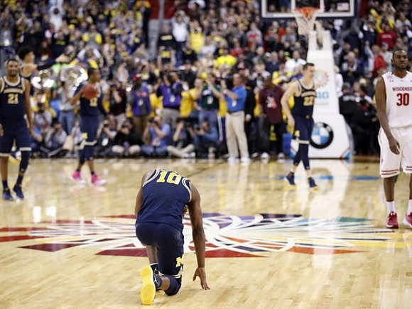 Zak Irvin (21), Derrick Walton Jr. (10), Muhammad-Ali Abdur-Rahkman (12), and Duncan Robinson (22)