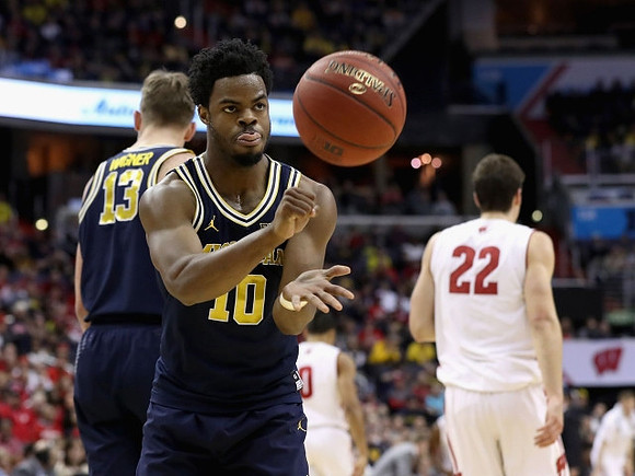 Moritz Wagner (13) and Derrick Walton Jr. (10)