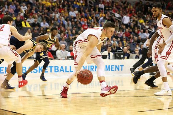Moritz Wagner (13) and Derrick Walton Jr. (10)