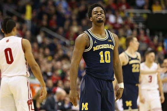 Derrick Walton Jr. (10) and Duncan Robinson (22)