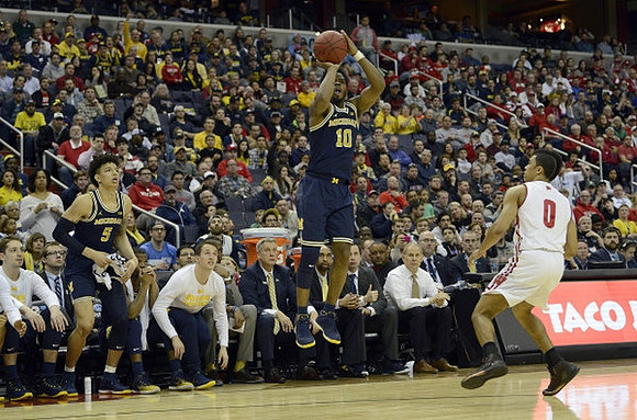 Derrick Walton Jr. (10) and D.J. Wilson (5)