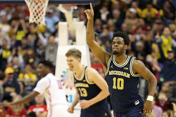 Moritz Wagner (13) and Derrick Walton Jr. (10)