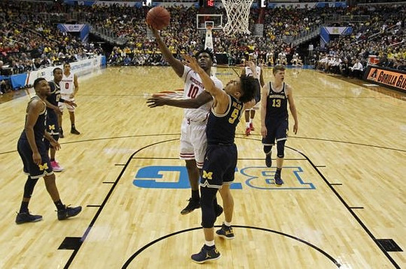 Zak Irvin (21), Muhammad-Ali Abdur-Rahkman (12), D.J. Wilson (5), and Moritz Wagner (13)