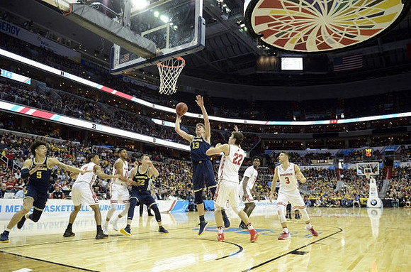 D.J. Wilson (5), Duncan Robinson (22), and Moritz Wagner (13)