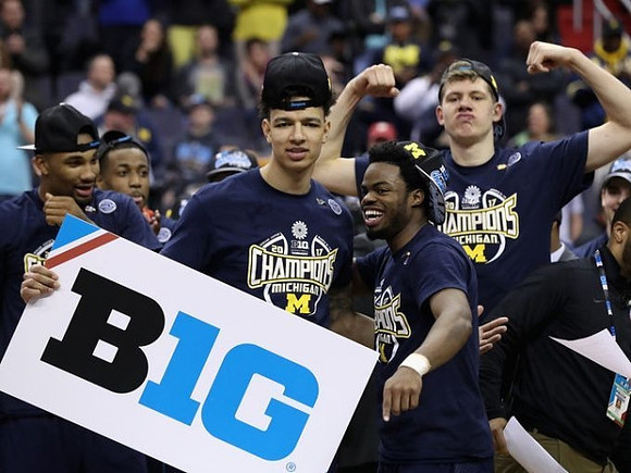 Zak Irvin (21), Muhammad-Ali Abdur-Rahkman (12), D.J. Wilson (5), Derrick Walton Jr. (10), and Moritz Wagner (13)