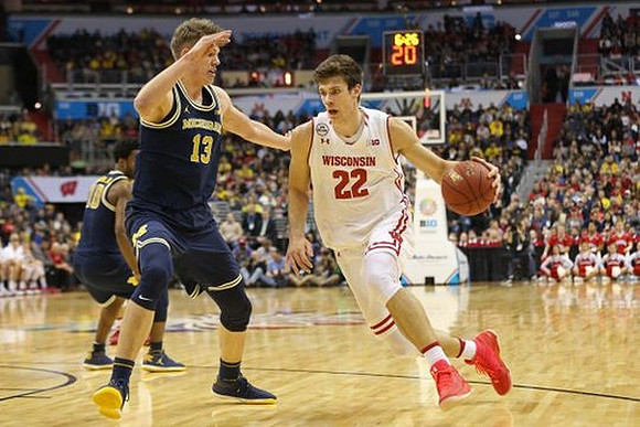 Derrick Walton Jr. (10) and Moritz Wagner (13)