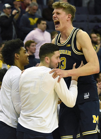 Ibi Watson (23), Sean Lonergan (20), and Moritz Wagner (13)