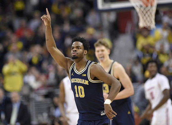 Derrick Walton Jr. (10) and Moritz Wagner (13)