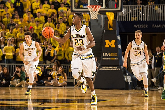 D.J. Wilson (5), Caris LeVert (23), and Mark Donnal (34)
