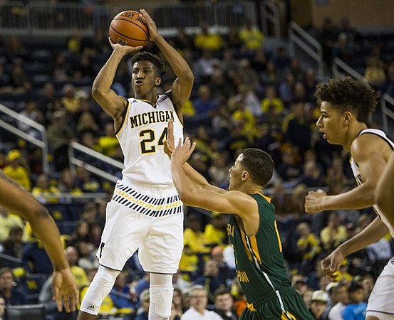 Aubrey Dawkins (24) and D.J. Wilson (5)