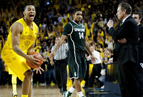 Trey Burke (3) and Michigan State Head Coach Tom Izzo