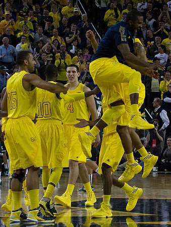 Jon Horford (15), Tim Hardaway Jr. (10), Mitch McGary (4), and Corey Person (32)