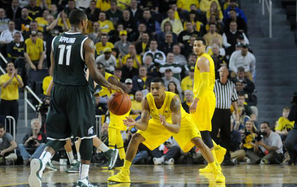 Trey Burke (3) and Jordan Morgan (52)